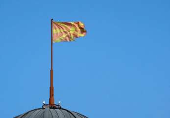 The national flag of North Macedonia waving in the wind in Skopje - obrazy, fototapety, plakaty