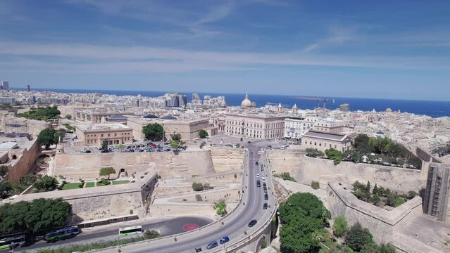 Aerial panoramic drone footage of Valletta, UNESCO World Heritage Site, Fort St Elmo, St. Paul's Cathedral, Grand Harbor Waterfront, Valletta, Malta