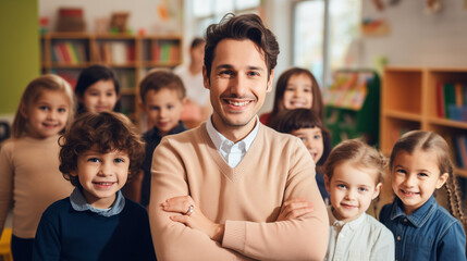 portrait of a kind male Montessori kindergarten teacher in a kindergarten with children, slight smile, candid