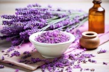 Obraz na płótnie Canvas lavender bunch next to a ceramic bowl filled with dried lavender for tea