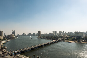 Aerial view of the city of Cairo, the Nile river and the bridge. Towers over the cityscape of this african metropolis.