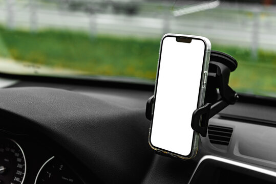 Universal car phone holder with white smartphone screen on windshield.