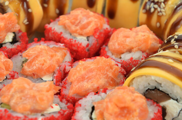background of different sushi rolls