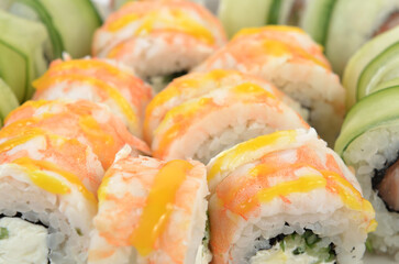 background of different sushi rolls