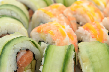 background of different sushi rolls