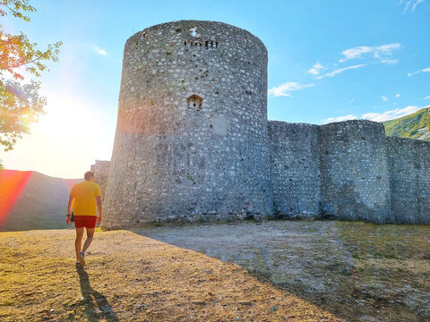Man walking towards old Drivenik Castle is located in the hinterland of Crikvenica and Novi Vinodolski, in the northern part of the Adriatic coast, western Croatia, Europe.