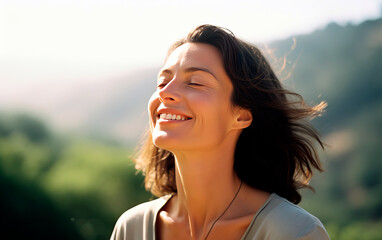 Middle-age woman breathing fresh air in the mountains. - obrazy, fototapety, plakaty