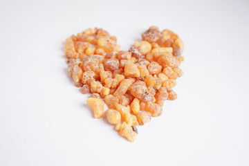 Frankincense or olibanum aromatic resin isolated on white background used in incense and perfumes.