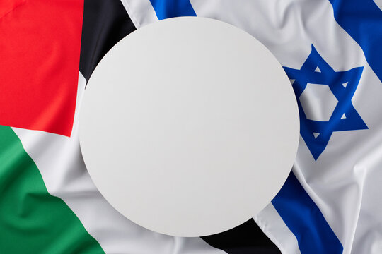 Making sense of the Israeli-Palestinian disagreement concept. Top view shot of Israeli flag, Palestinian flag with blank circle for special message
