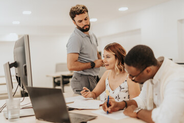 Diverse business team collaborating for profit growth in modern office.