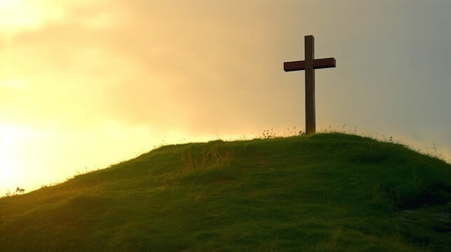 christian cross  on top of mountain at sunset.