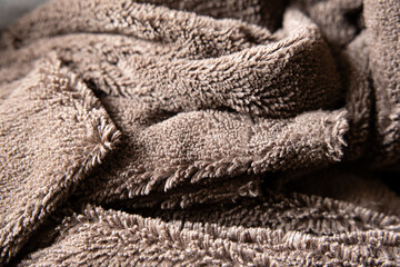 Fototapeta na wymiar brown fur blanket curled up in a pile