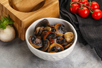 Roasted champignon mushrooms in the bowl