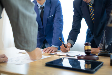 Businessmen and investors sign contract in front of company legal advisor and witness contract for...