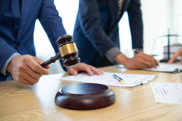 judge's gavel in law office is placed on table to symbolize judge deciding lawsuit. gavel wood on wooden table of lawyers in legal advice office as symbol of fair judgment in cases.
