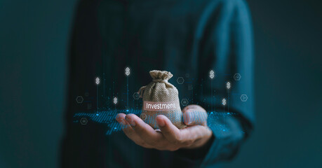 a hand confidently holds a money bag, related to wealth, investment, and financial success. the idea of smart financial planning of profit, income, budget, earning, and retirement planning.