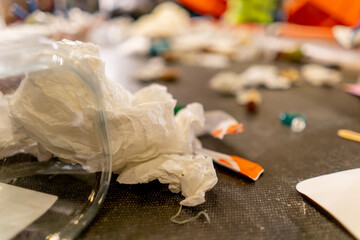 Close-up shot of plastic containers of bottles and bags located on a waste sorting line at waste...