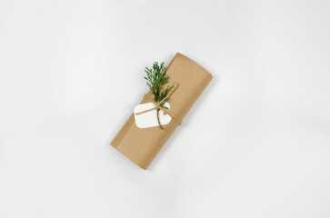 Christmas and New Year craft package with tree branch on white background. Top view of christmas minimalist decorations