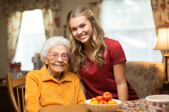 Caregiver hugging a smiling senior woman in a retirement home
