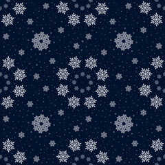 Christmas winter seamless background with snowflakes. Dark blue background with snowflakes