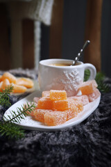 Christmas citrus dessert, orange jelly sweets and cup of coffee, New Year's decoration - 668700725