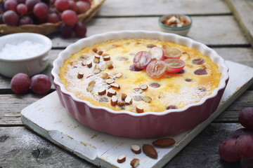 French cuisine. Red grape clafoutis, almondes dressing - 668701928