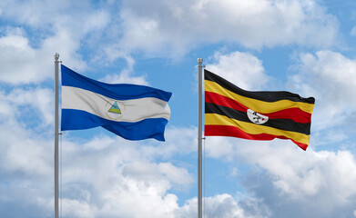 Uganda and Nicaragua flags, country relationship concept