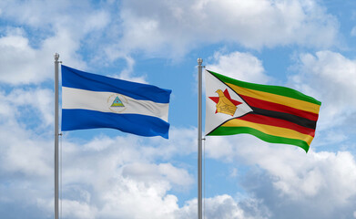 Zimbabwe and Nicaragua flags, country relationship concept
