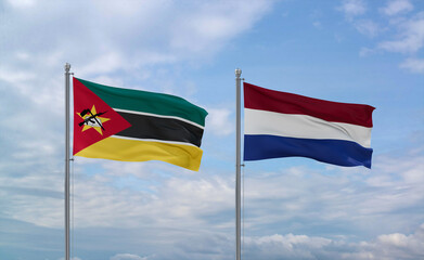 Netherlands and Mozambique flags, country relationship concept