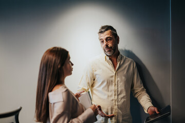 Diverse professionals analyze market data, discuss strategies, and work together to maximize profit. Multiracial team focuses on planning, productivity, and target group analysis for their business.