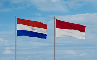 Indonesia and Paraguay flags, country relationship concept