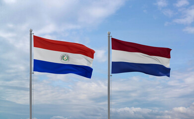 Netherlands and Paraguay flags, country relationship concept
