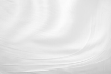 White cloth background abstract with soft waves.Abstract White Bedding Sheets or White wrinkled fabric background texture and Texture with copy-space :Creased or wrinkled white fabric,Soft focus