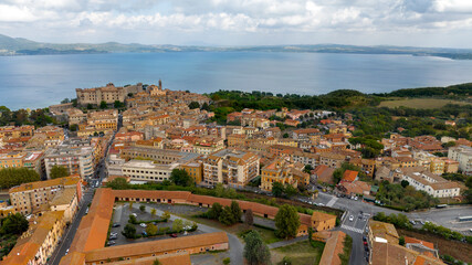 Naklejka premium Aerial view of Bracciano, in the metropolitan city of Rome, Italy. The town is located on the shores of Lake Bracciano. In the historic center there is the castle and cathedral of Santo Stefano.