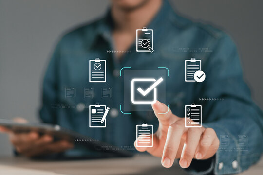 Businessman touching approved document icon on digital documents for approve business project proposals. Quality assurance and online evaluation of business concept.