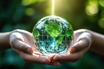 Foto op Aluminium Hands holding glass globe world In green forest with warm sunlight. earth day environment conservation concept. © Thanaphon