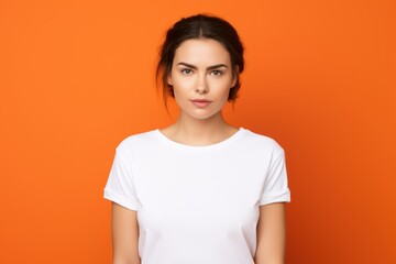 Portrait of a fictional beautiful young woman in a blank t-shirt smiling. Isolated on a plain colored background. Generative AI.