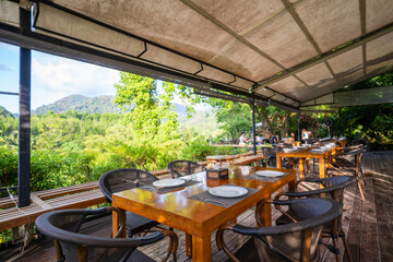 dining table set in restaurant with mountain view