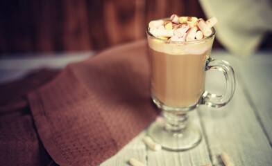 Delicious coffee with marshmallows and milk. Cappuccino with nut syrup flavor.