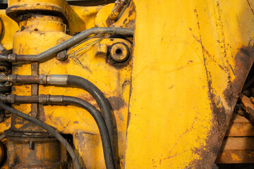 Hydraulic high pressure hose connection panel with safety fittings of the crane of excavator machine. Industrial equipment object, close-up and selective focus.