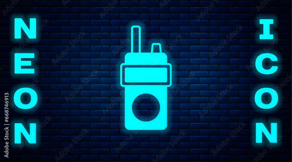 Sticker glowing neon walkie talkie icon isolated on brick wall background. portable radio transmitter icon. 