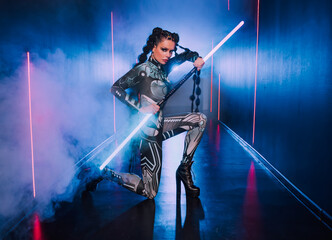 Fashion model posing Fantasy cyborg woman creative robot costume metal body creative makeup,...