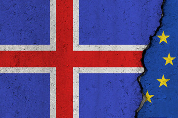 Fototapeta premium Iceland and EU flag cracked on a concrete background