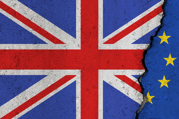 Fototapeta premium United Kingdom and EU flag cracked on a concrete background