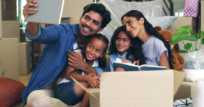 Digital tablet, selfie and Indian family smile for photo or memory after moving in to new house. Real estate, profile picture and kids with parents in living room for relocating or dream home success