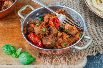 Meatballs in a tomato and lentil sauce