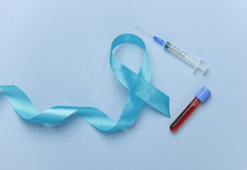 Blue ribbon symbolizing support of men and blood test tube. Blue november prostate cancer awareness...