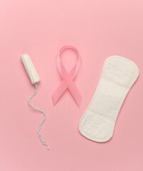 Pink ribbon, breast cancer awareness symbol with tampon and pad
