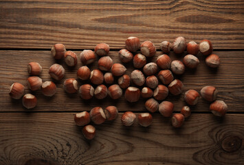 Hazelnuts on a wooden table. Top view