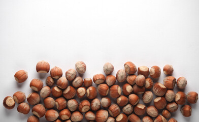 Hazelnuts on a white background. Top view. Copy space